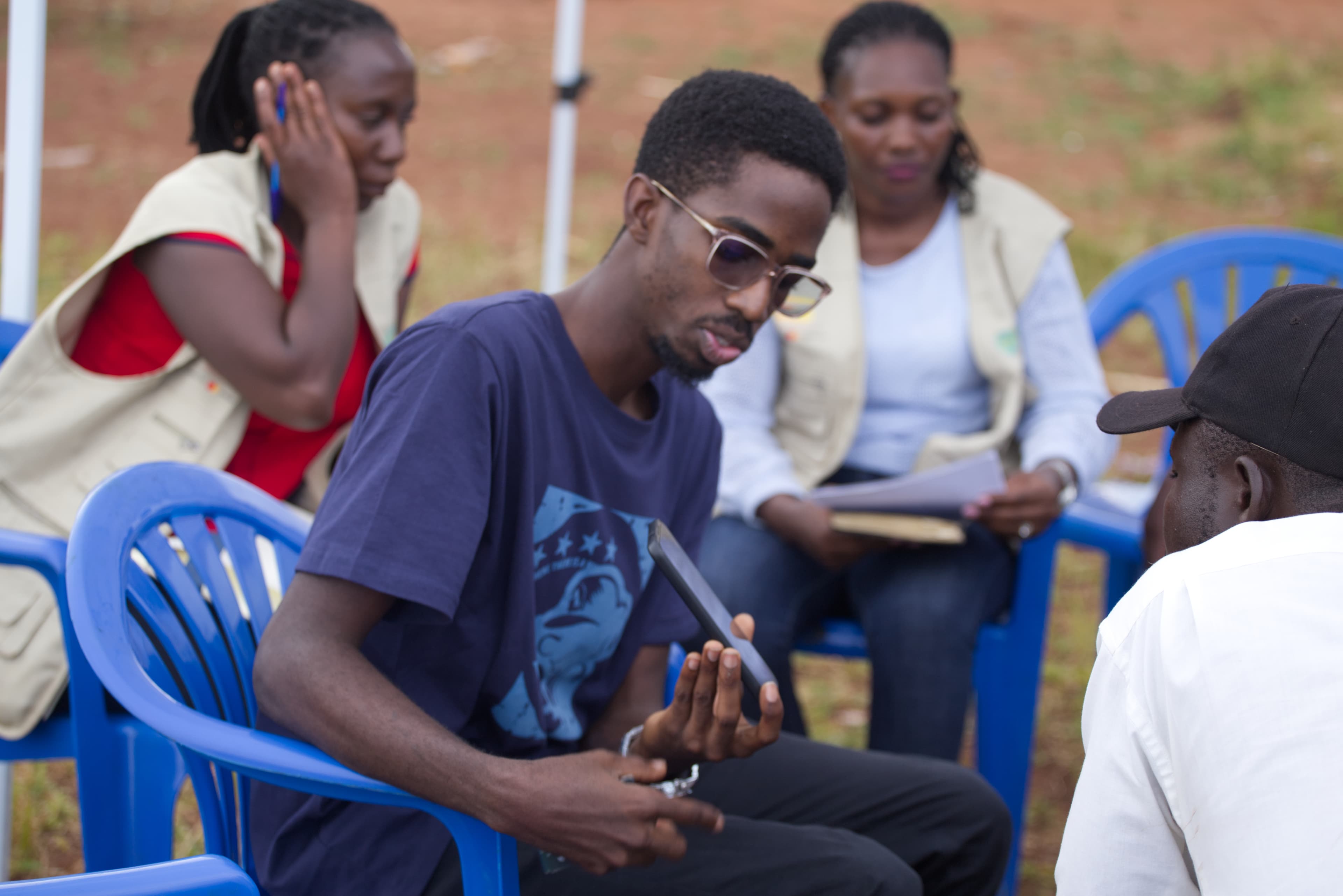 Field officer interviewing a respondent outdoors